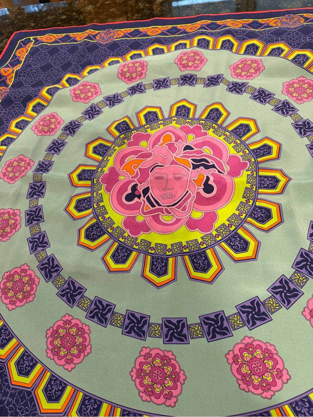 Versace scarf colorful Medusa head print.